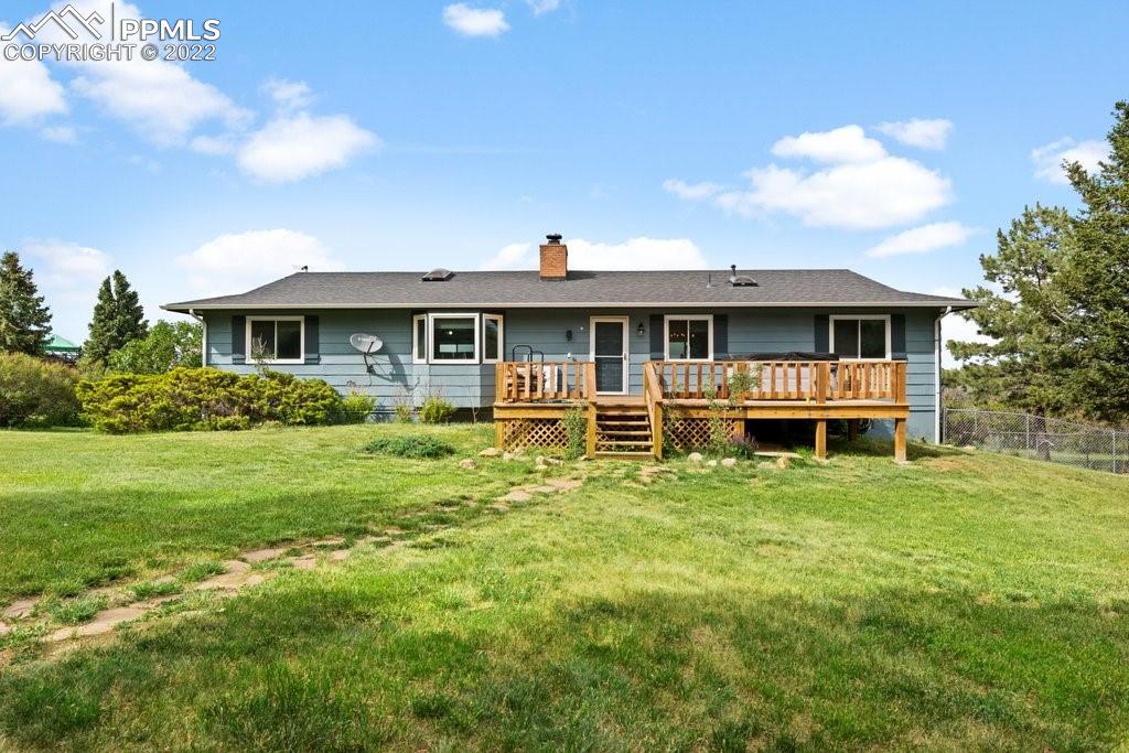 1847 County Road, Unit 671 Rye, CO 81069 - Photo 4 of 42 a front view of a house with a yard table and chairs