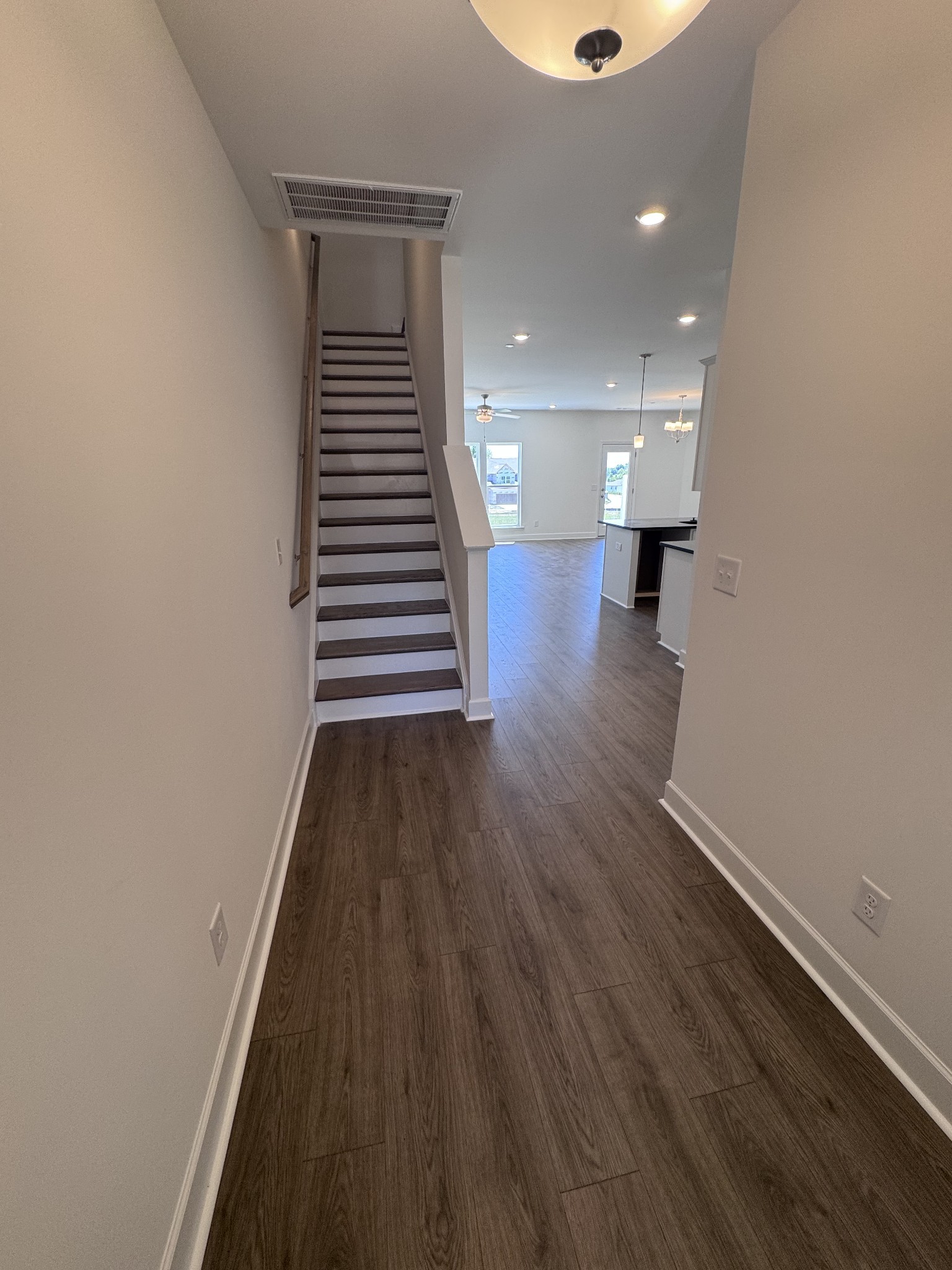 1095 June Wilde Ridge Spring Hill, TN 37174 - Photo 6 of 33 a view of entryway and hall with wooden floor