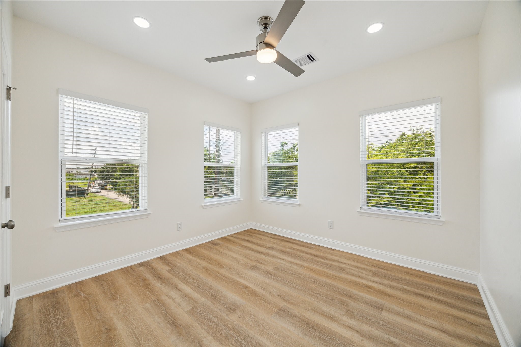 901 East 37th Street Houston, TX 77022 - Photo 15 of 19 a view of an empty room with wooden floor and a window