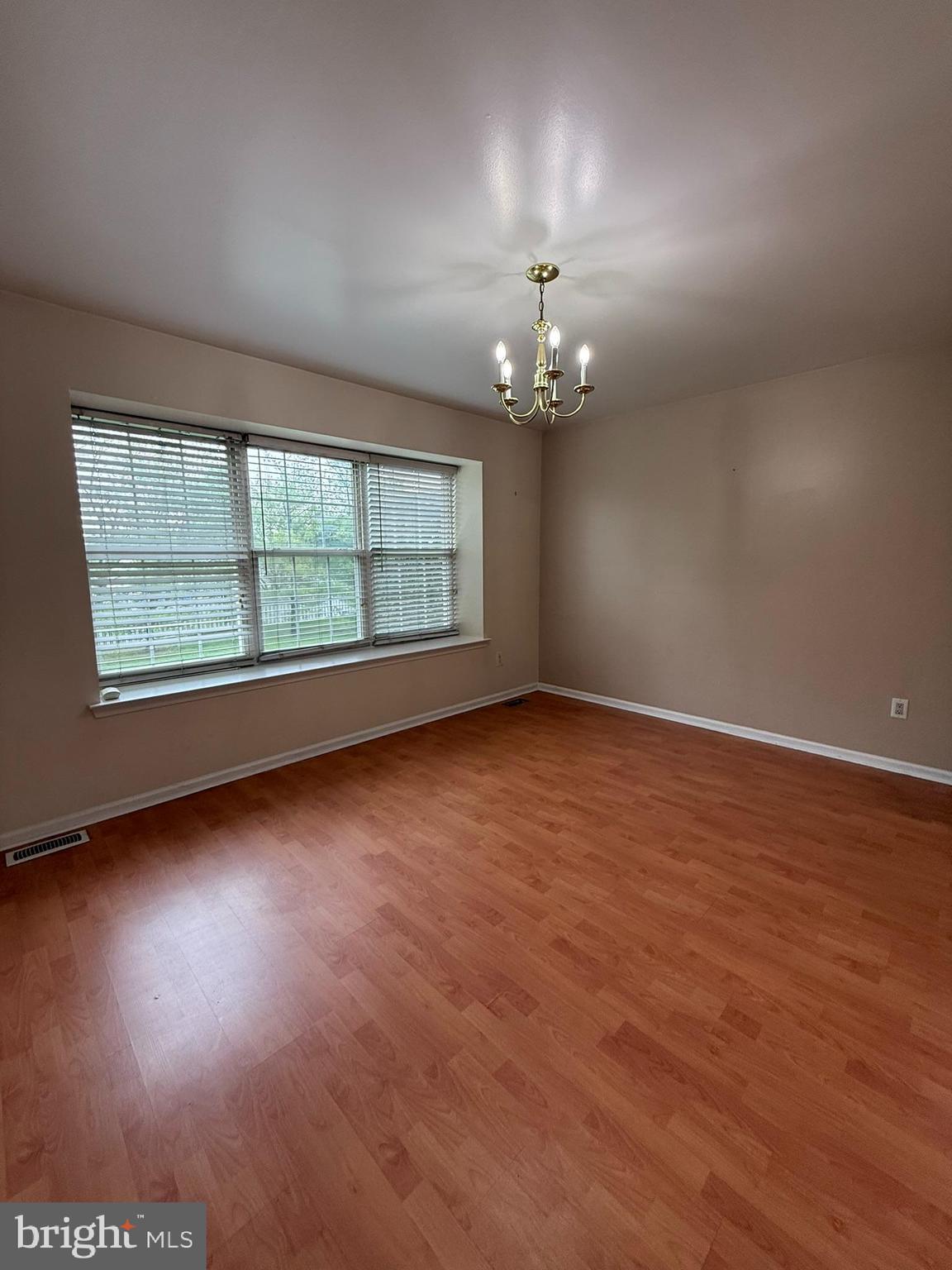 2605 Gramercy Way Mount Laurel, NJ 08054 - Photo 14 of 44 an empty room with wooden floor and windows