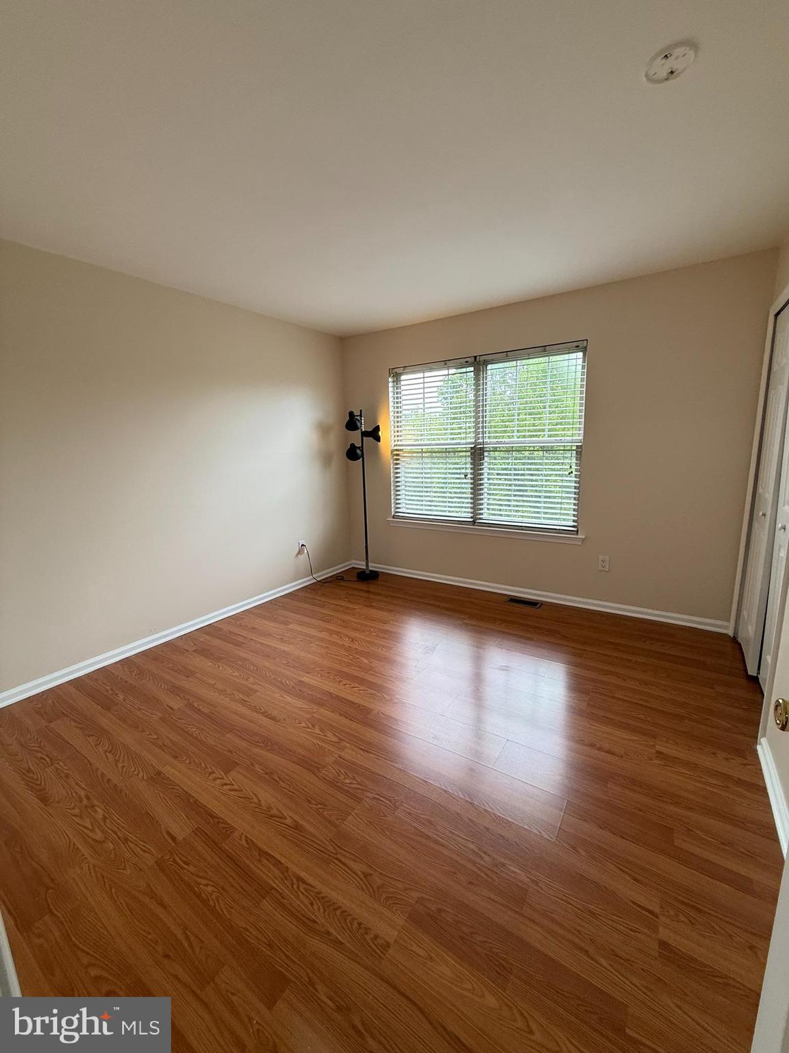 2605 Gramercy Way Mount Laurel, NJ 08054 - Photo 33 of 44 an empty room with wooden floor and windows