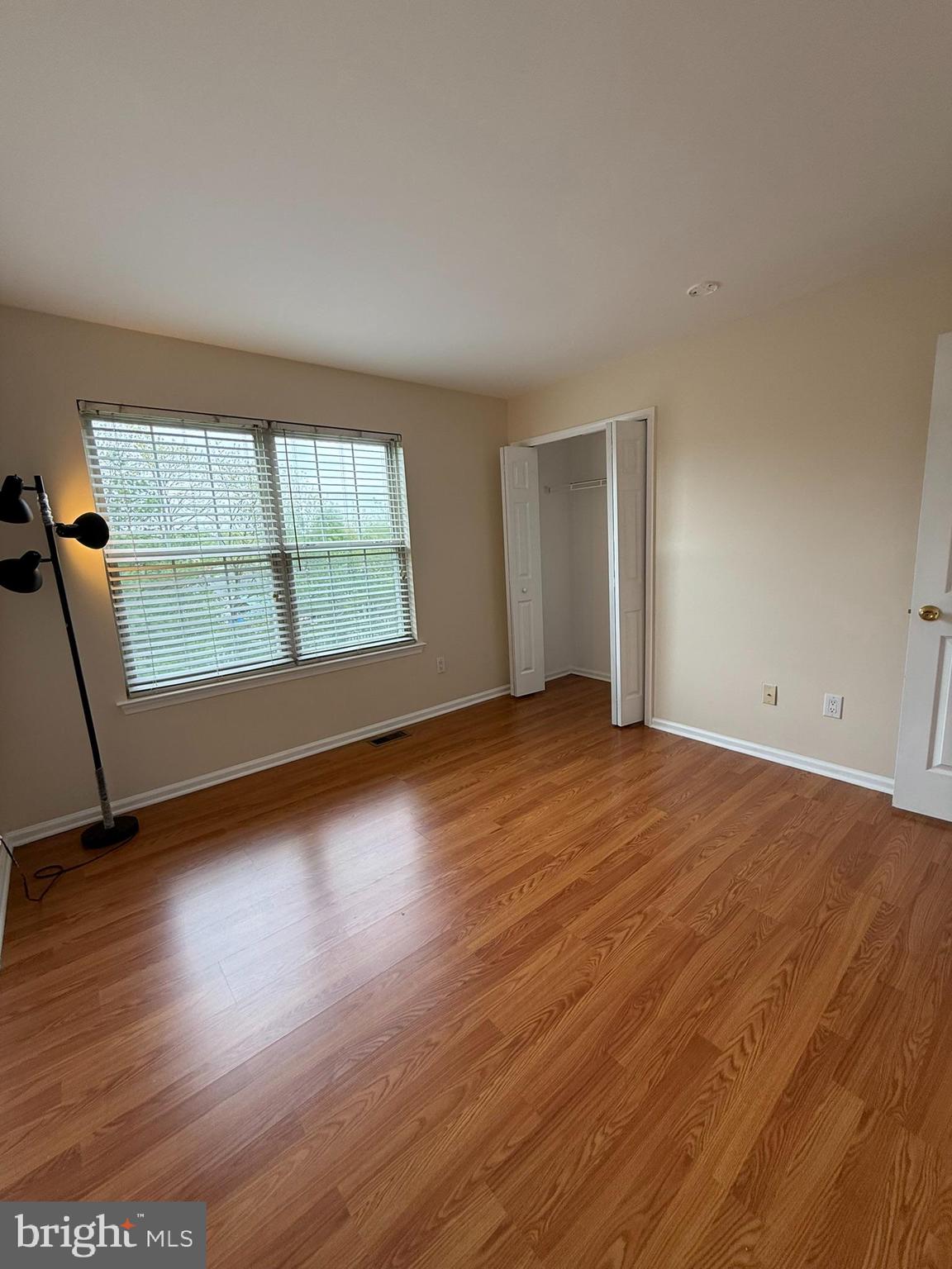 2605 Gramercy Way Mount Laurel, NJ 08054 - Photo 34 of 44 an empty room with wooden floor and windows