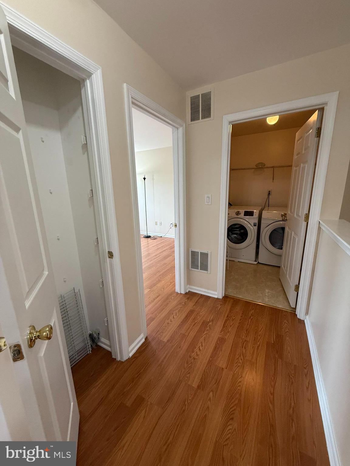 2605 Gramercy Way Mount Laurel, NJ 08054 - Photo 35 of 44 a view of a hallway with wooden floor and a living room