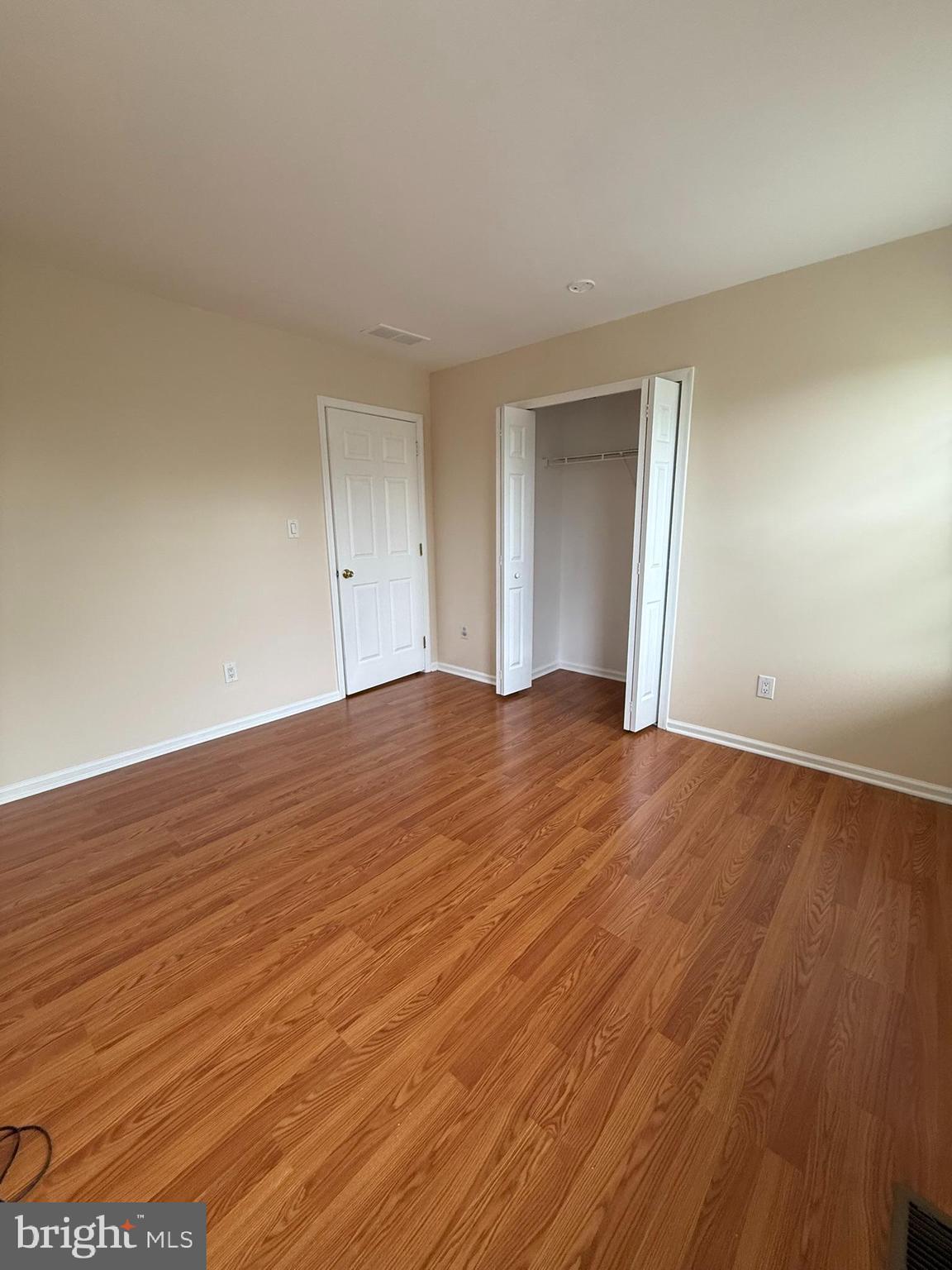 2605 Gramercy Way Mount Laurel, NJ 08054 - Photo 38 of 44 a view of an empty room with wooden floor and a window