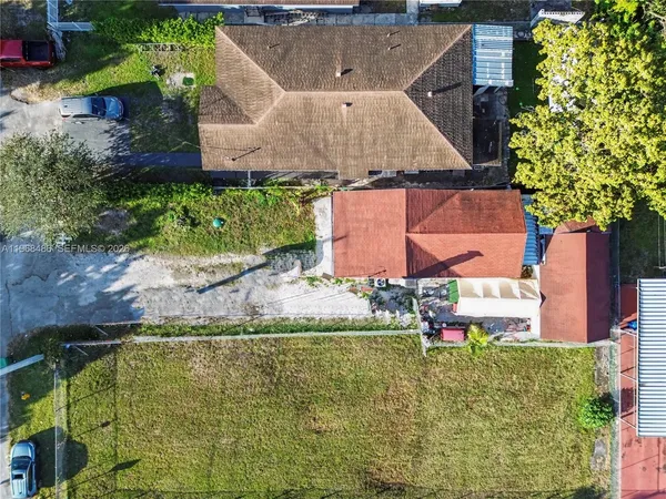 an aerial view of residential house with outdoor space