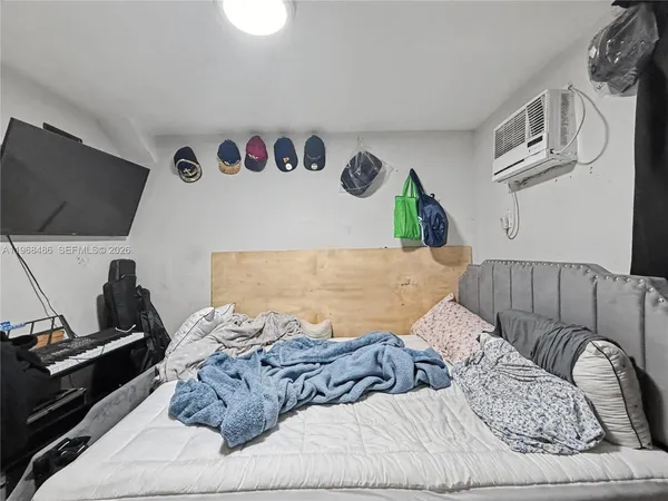 a living room with a couch and a flat screen tv