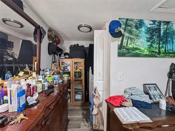 a bed room with a bed and a dresser