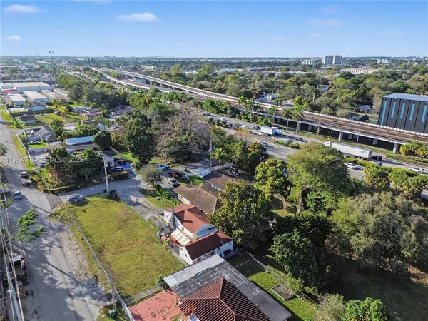 an aerial view of a house with a garden