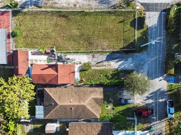 an aerial view of a house with a lake view