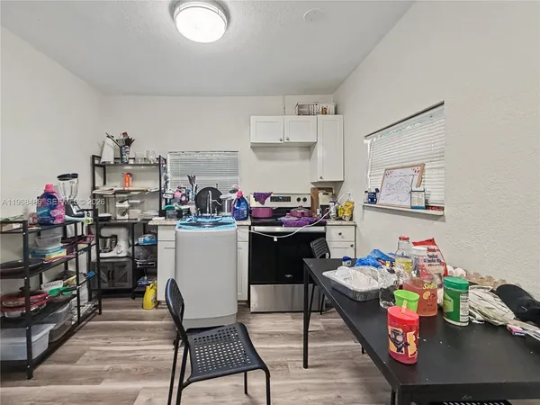 a room with furniture and a dining table