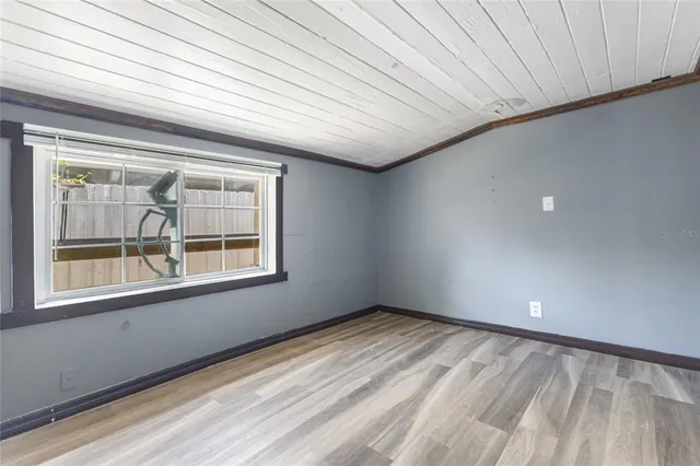 a view of an empty room with a window