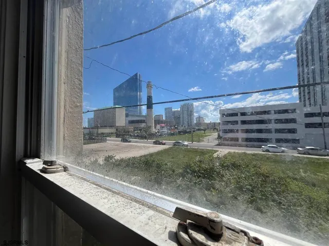 a view of a kitchen with a sink and a window