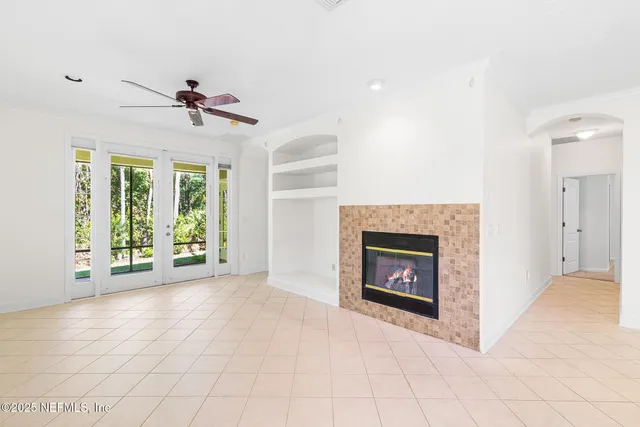 a view of an empty room with a fireplace