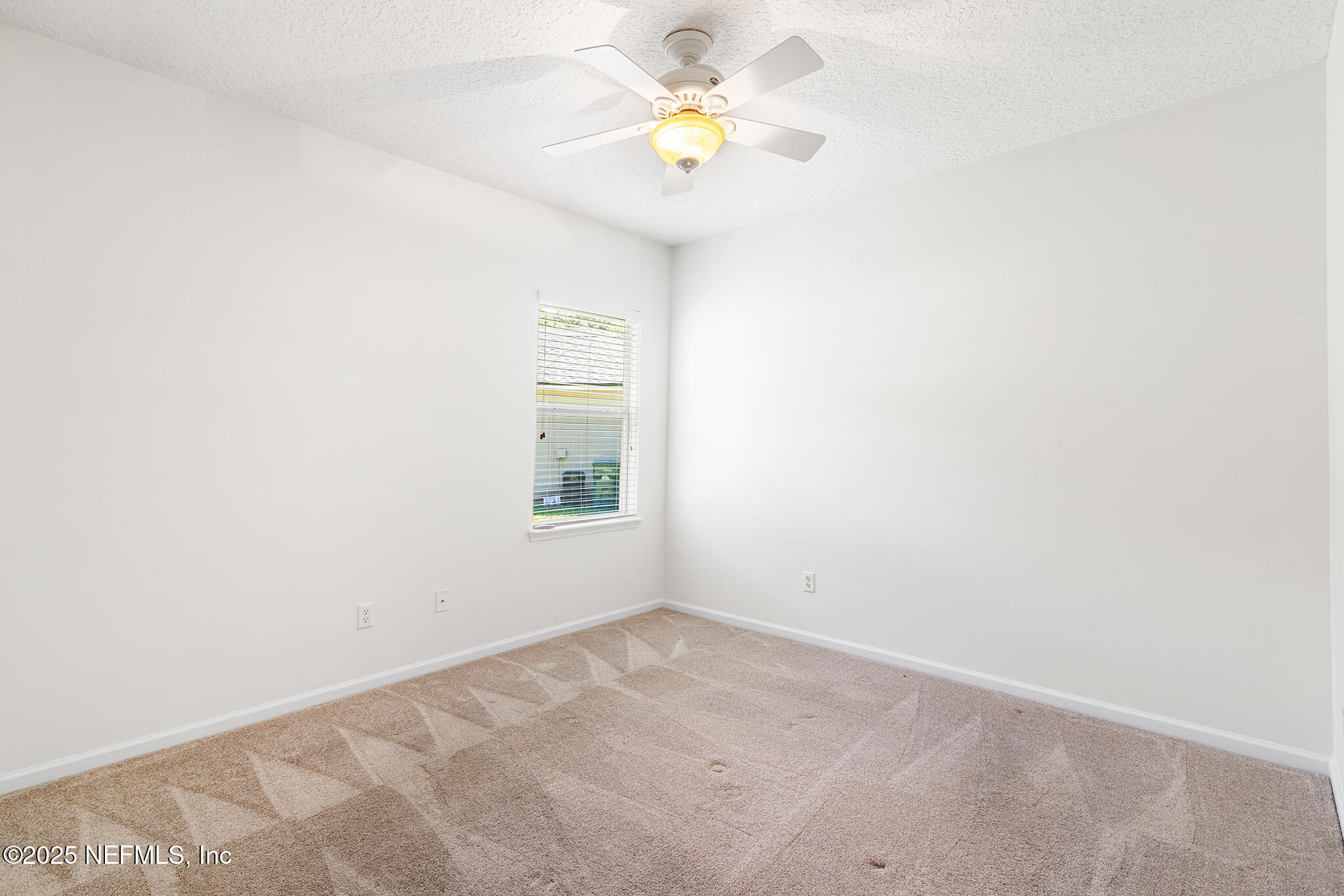 6121 Caladesi Court Jacksonville, FL 32258 - Photo 26 of 44 a view of an empty room with a window