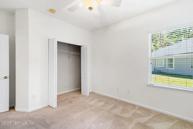 a blue swimming pool is in a backyard of a house