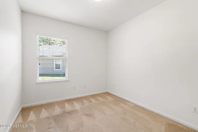 a view of residential house with outdoor space and lake