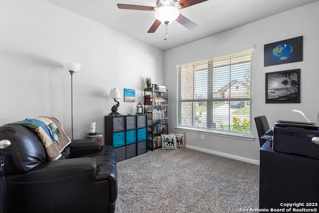 a living room with furniture and a window