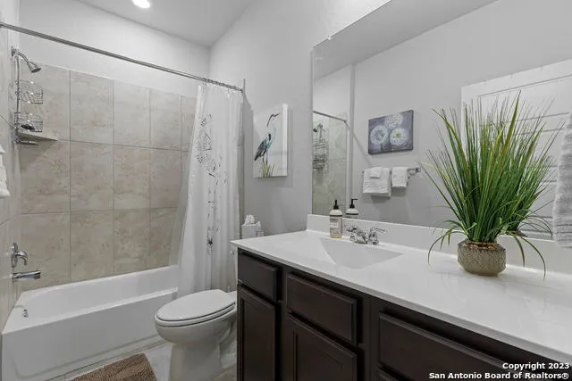 a bathroom with a sink a toilet and a bathtub