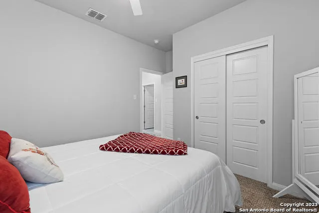 a bedroom with a bed and a closet