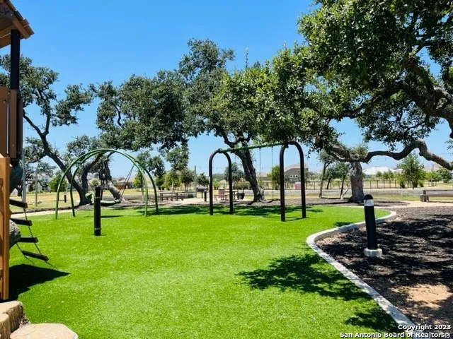 a view of houses with swimming pool