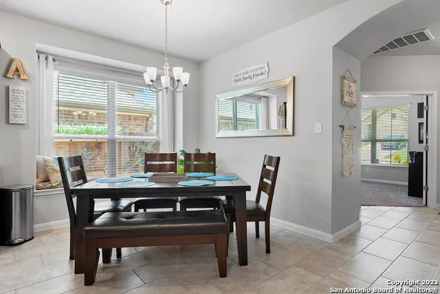 a view of a dining room with furniture
