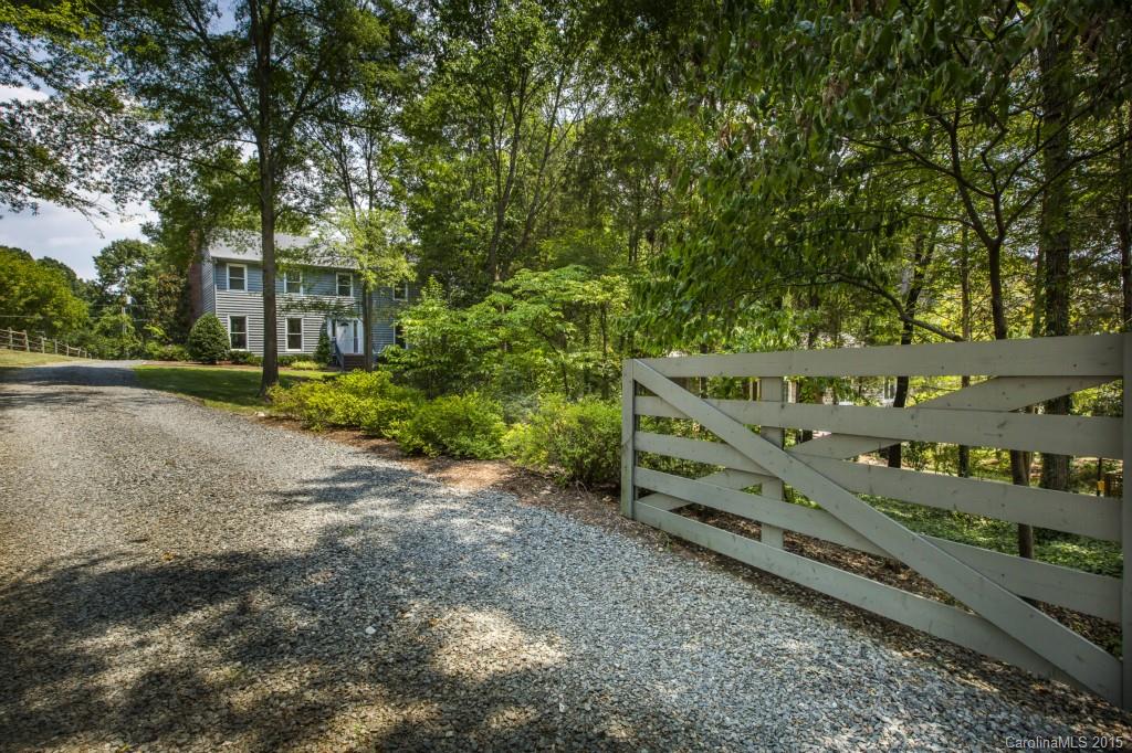 7131 Ramsgate Road Charlotte, NC 28270 - Photo 2 of 24 a view of a wooden house with a large trees