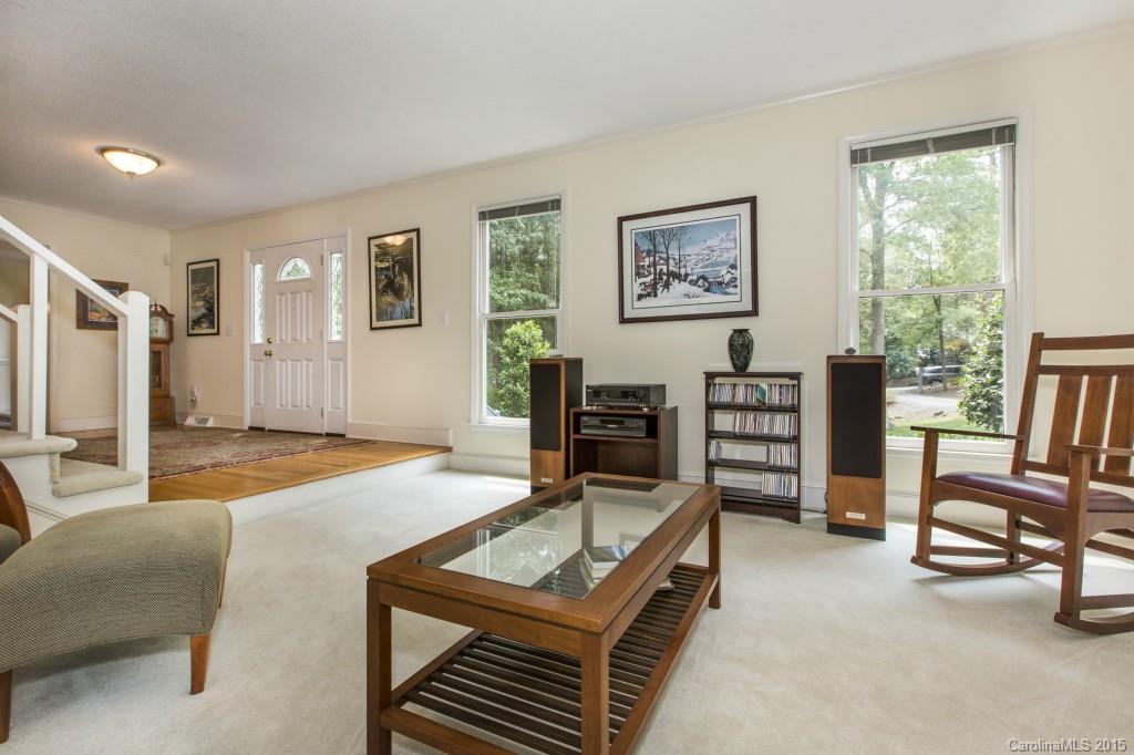 7131 Ramsgate Road Charlotte, NC 28270 - Photo 11 of 24 a living room with furniture a flat screen tv and a table