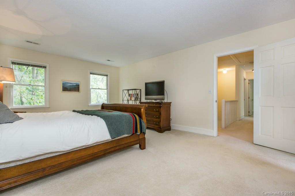 7131 Ramsgate Road Charlotte, NC 28270 - Photo 14 of 24 a bedroom with a bed and a tv