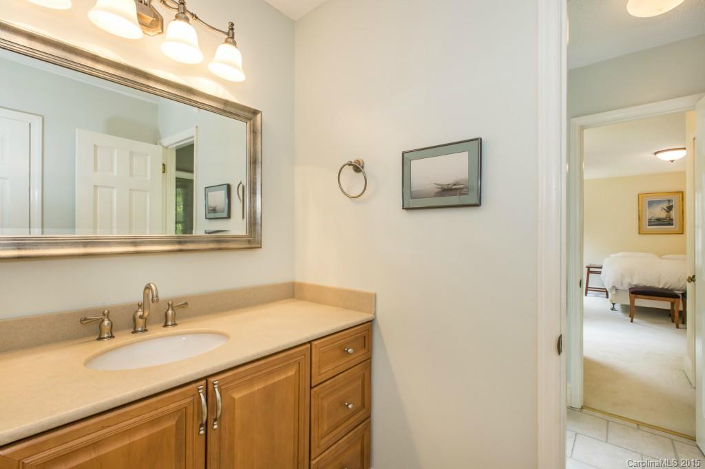 7131 Ramsgate Road Charlotte, NC 28270 - Photo 18 of 24 a bathroom with a granite countertop sink and a mirror