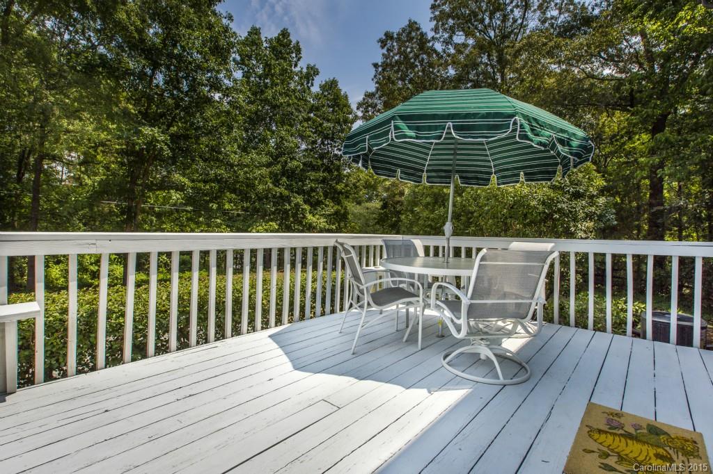 7131 Ramsgate Road Charlotte, NC 28270 - Photo 20 of 24 a roof deck with chairs and wooden floor