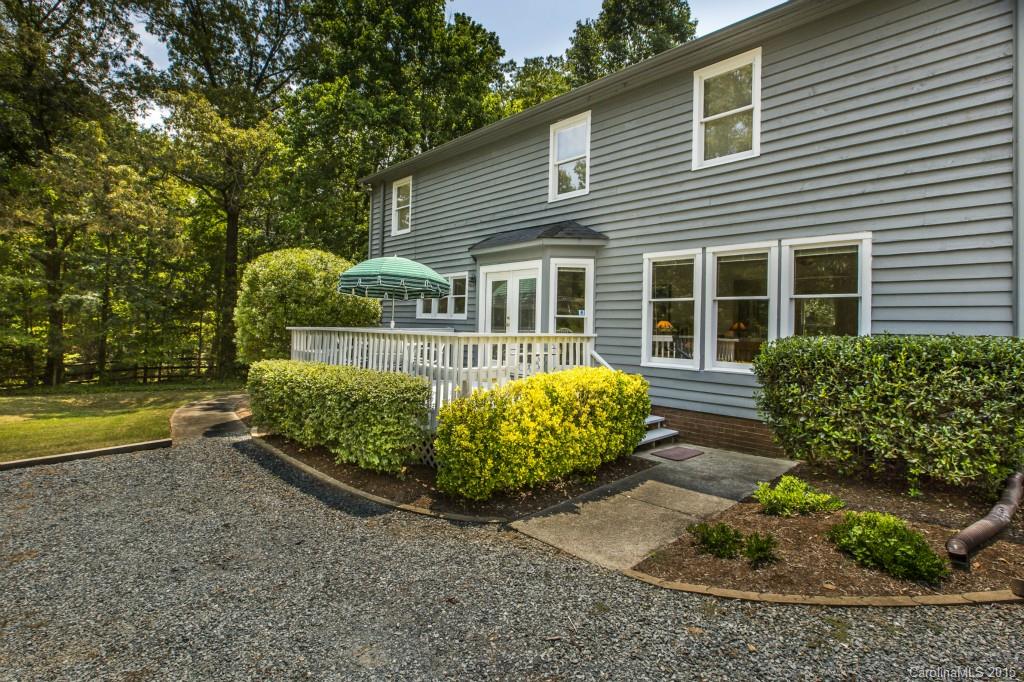 7131 Ramsgate Road Charlotte, NC 28270 - Photo 21 of 24 a front view of a house with garden