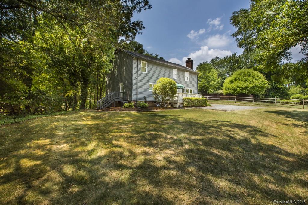 7131 Ramsgate Road Charlotte, NC 28270 - Photo 23 of 24 a view of a house with a big yard and large tree