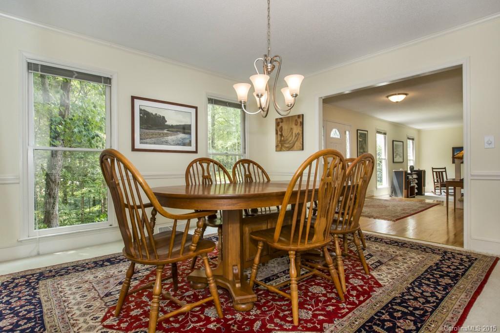 7131 Ramsgate Road Charlotte, NC 28270 - Photo 5 of 24 a view of a dining room with furniture window and wooden floor
