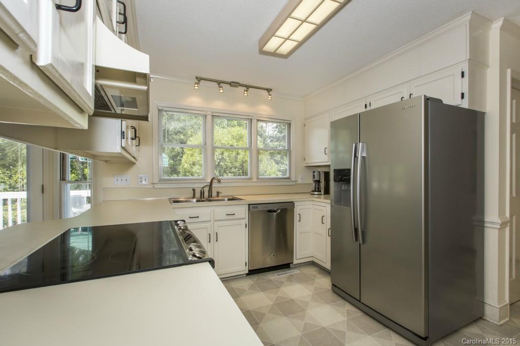 7131 Ramsgate Road Charlotte, NC 28270 - Photo 6 of 24 a kitchen with stainless steel appliances a refrigerator sink and cabinets