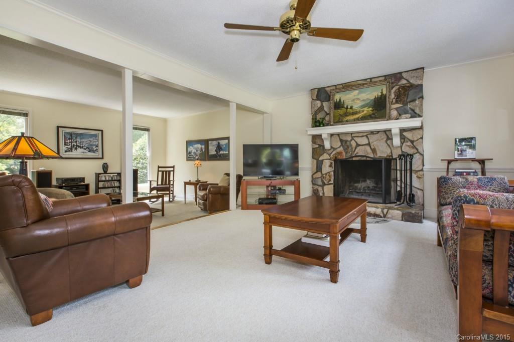 7131 Ramsgate Road Charlotte, NC 28270 - Photo 8 of 24 a living room with furniture and a fireplace