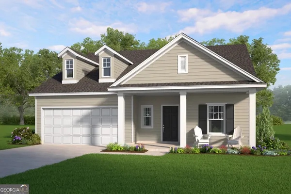 a front view of a house with a yard and green space