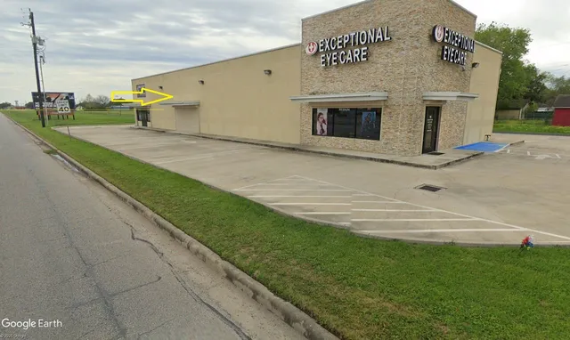 a front view of a building with garden