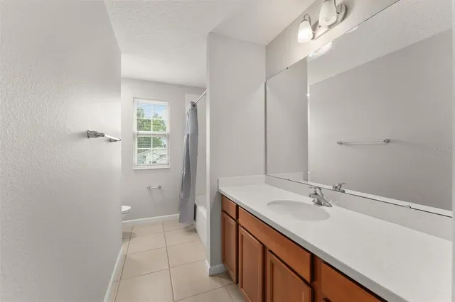 a bathroom with a sink double vanity and a mirror