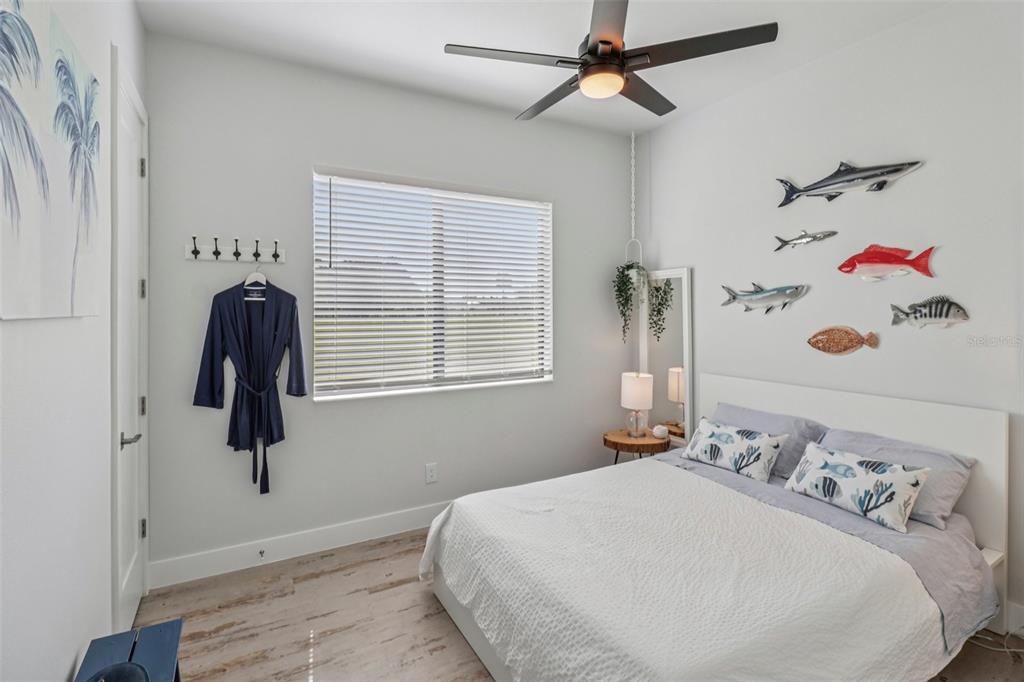 3385 Lake Diane Road Tavares, FL 32778 - Photo 16 of 49 a bedroom with a bed and a window