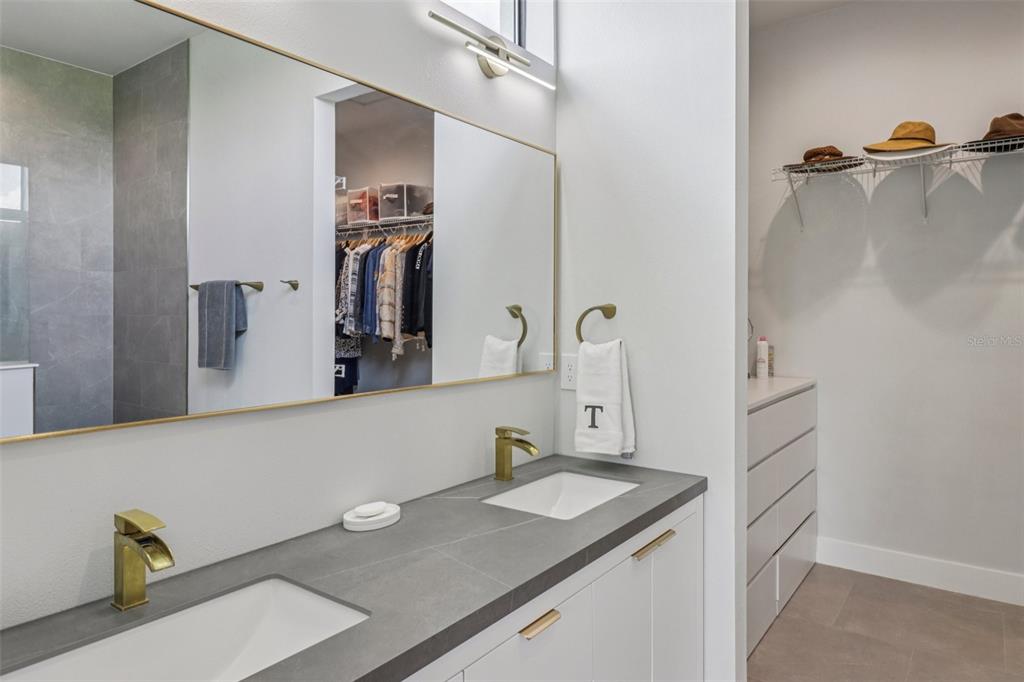 3385 Lake Diane Road Tavares, FL 32778 - Photo 22 of 49 a bathroom with a granite countertop sink and a mirror