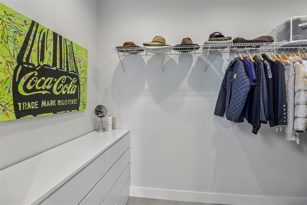 3385 Lake Diane Road Tavares, FL 32778 - Photo 25 of 49 a view of walk in closet with clothes and shoes