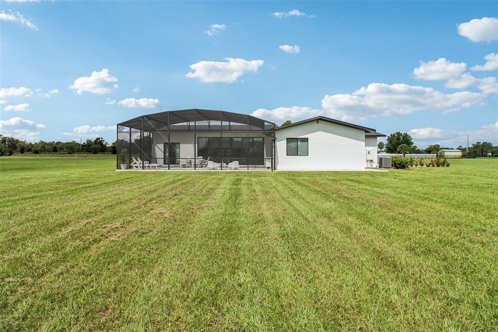 3385 Lake Diane Road Tavares, FL 32778 - Photo 28 of 49 a view of a house with a yard