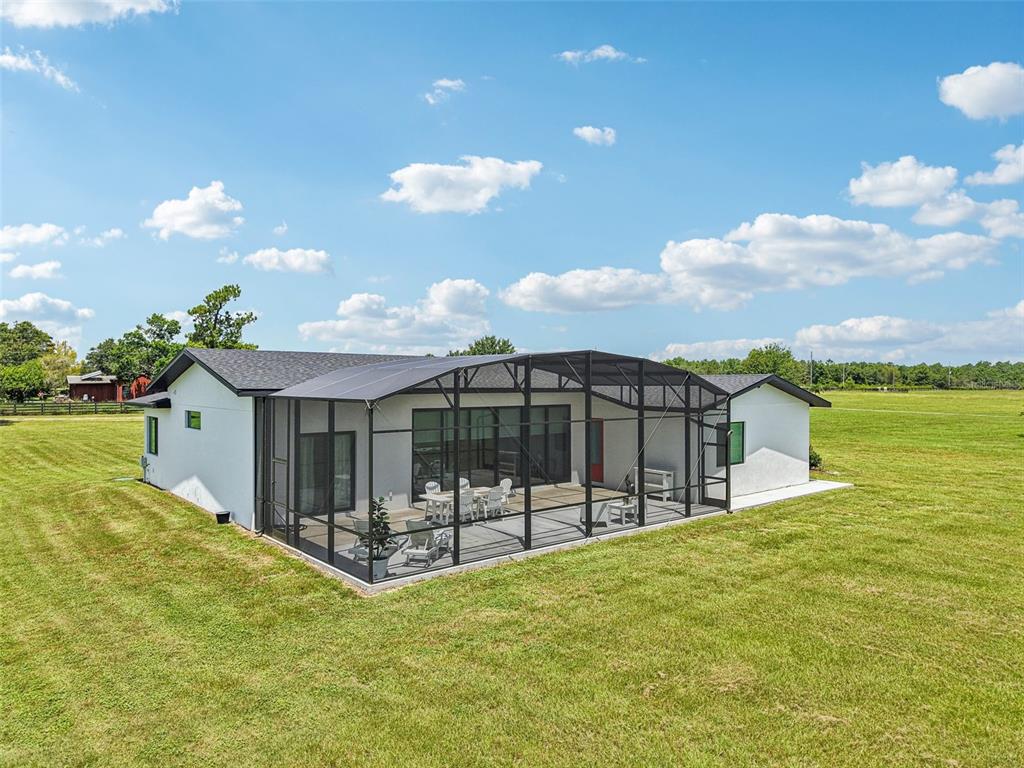3385 Lake Diane Road Tavares, FL 32778 - Photo 33 of 49 a view of a house with a wooden fence