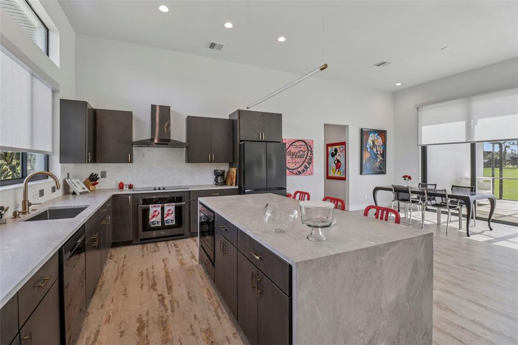 3385 Lake Diane Road Tavares, FL 32778 - Photo 4 of 49 a kitchen with a sink stove top oven and microwave