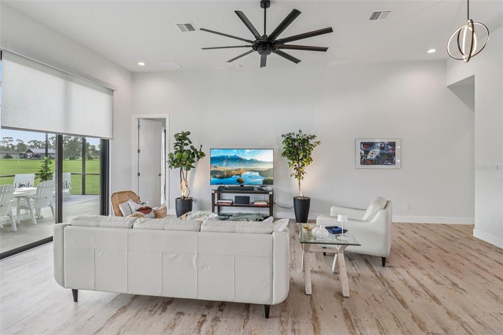 3385 Lake Diane Road Tavares, FL 32778 - Photo 6 of 49 a living room with furniture and a large window