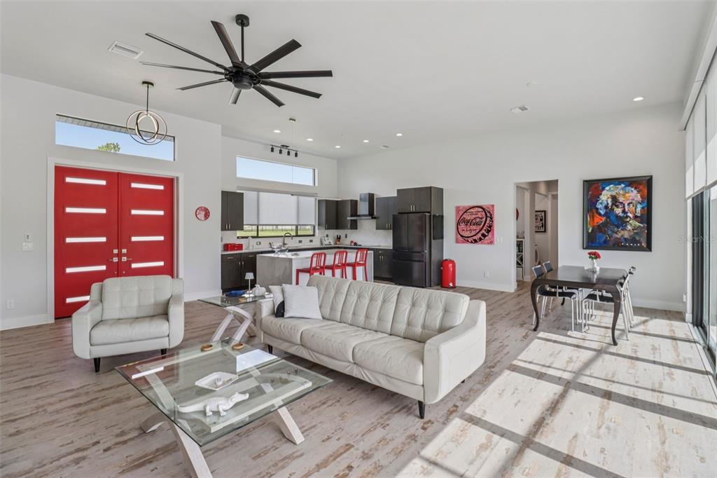 3385 Lake Diane Road Tavares, FL 32778 - Photo 7 of 49 a living room with furniture and kitchen view