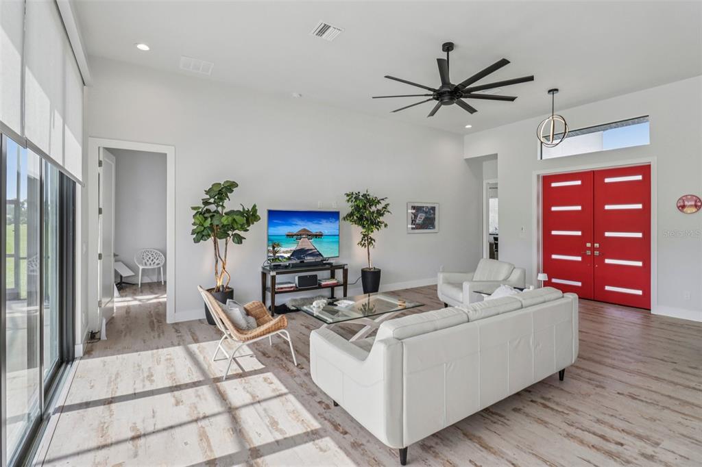 3385 Lake Diane Road Tavares, FL 32778 - Photo 8 of 49 a living room with furniture and a wooden floor