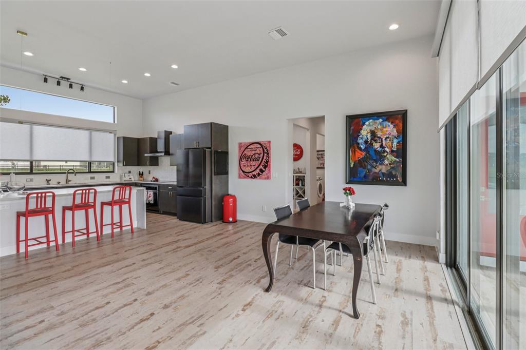 3385 Lake Diane Road Tavares, FL 32778 - Photo 9 of 49 a view of kitchen with stainless steel appliances kitchen island microwave and wooden floor