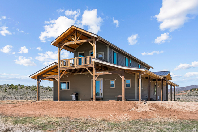 46997 West Thunder Road Fruitland, UT 84027 - Photo 1 of 49 Back of house featuring a metal roof and a wooden deck