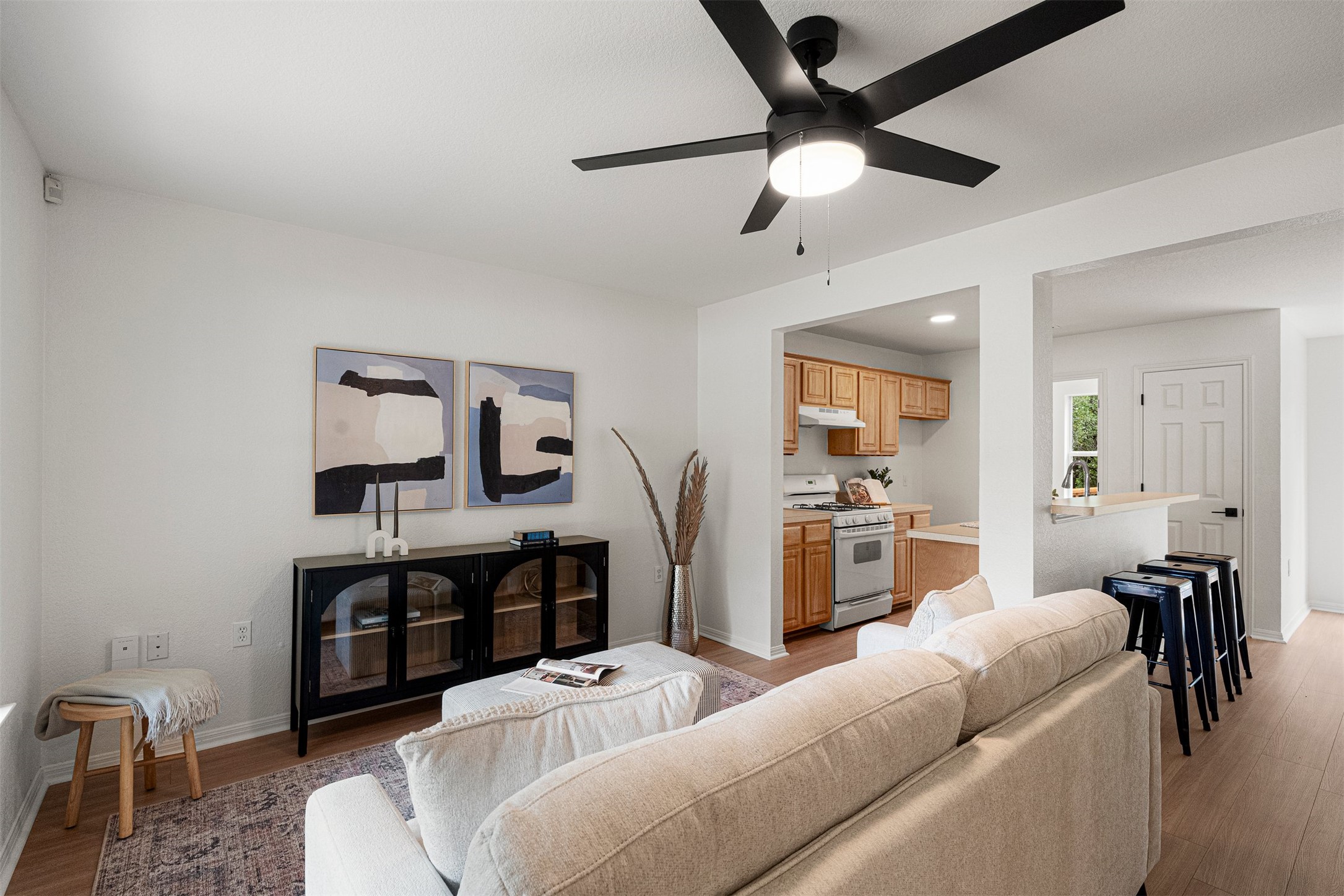3003 Glen Rae Street Austin, TX 78702 - Photo 6 of 38 An updated, modern ceiling fan ensures the living room stays cool and comfortable